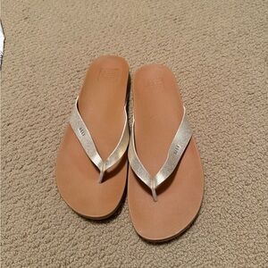Tan and Gold Flip Flops